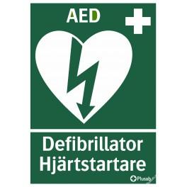 Skylt grön och vit med text AED Defibrillator Hjärtstartare